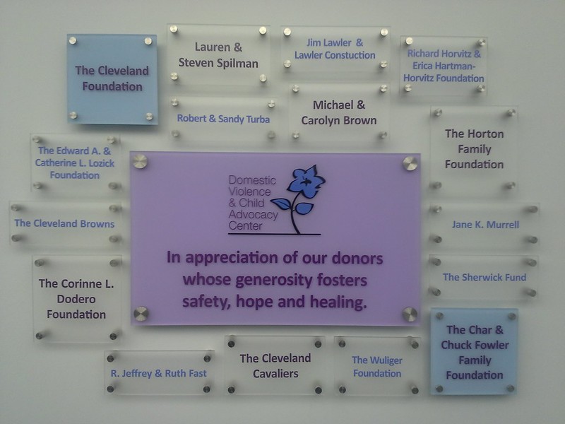 Donor wall of acrylic panels to appreciate sponsors of the Domestic Violence and Child Advocacy Center