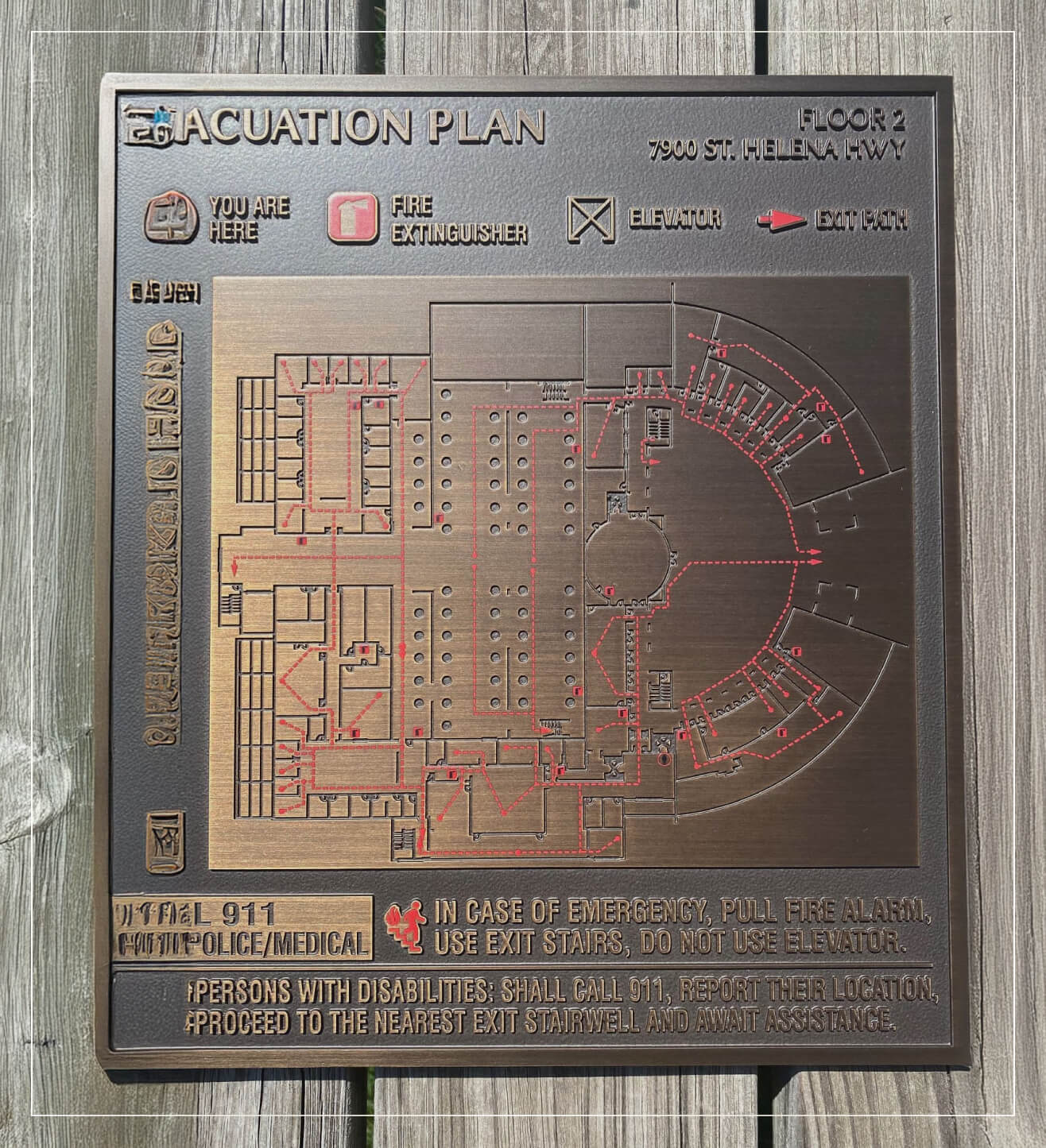 Example of a bronze fire escape sign.