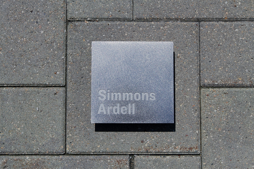 Etched stainless steel plaque with RANDOM ORBITAL finish Background and Recessed letters NO paint fill Blind studs for mounting