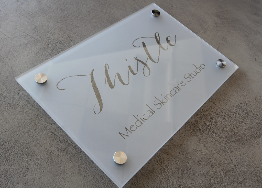 Frosted glass panel sign with custom logo clear