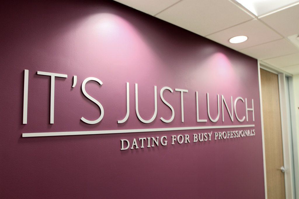 Pigmented White acrylic lettering and rule line for interior lobby logo sign
