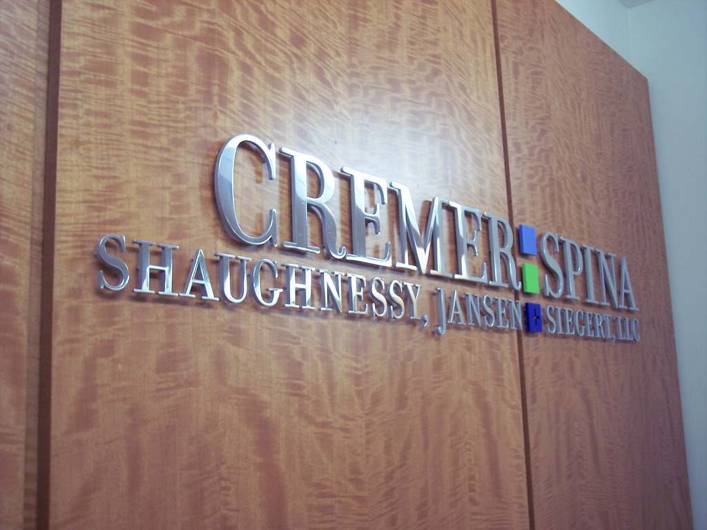 Polished stainless steel letters for law office logo lobby sign